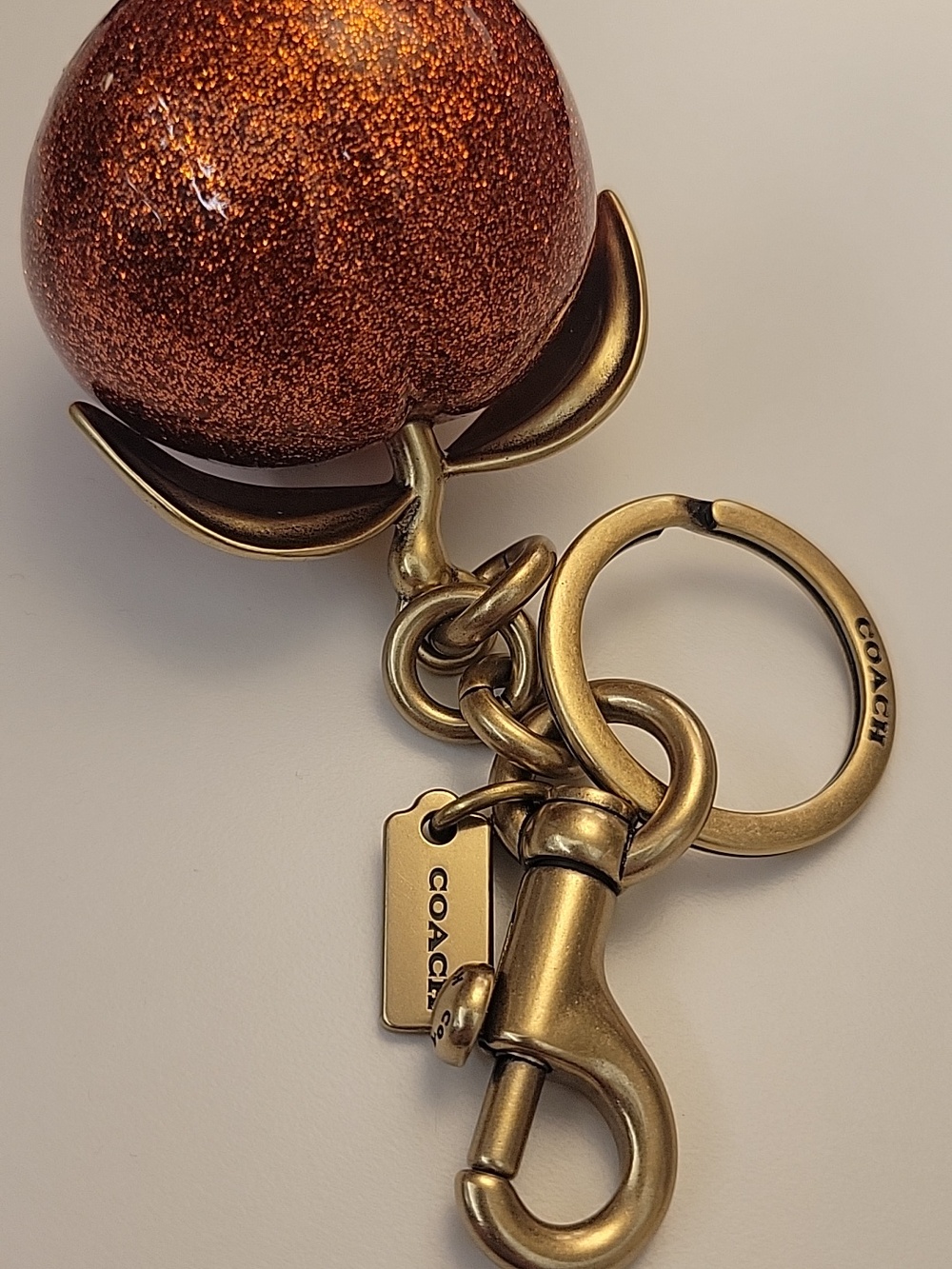 Coach Glitter Peach Pom Keychain - Picture 6 of 7